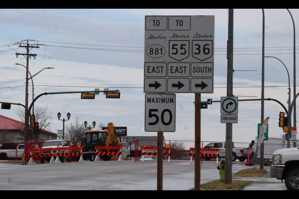The signs are telling you the "right" way to get around the full block of closed downtown roadway in Lac La Biche.  The construction and detours are part of a 3 year, $31.5 million project to upgrade utilities and revamp the downtown.