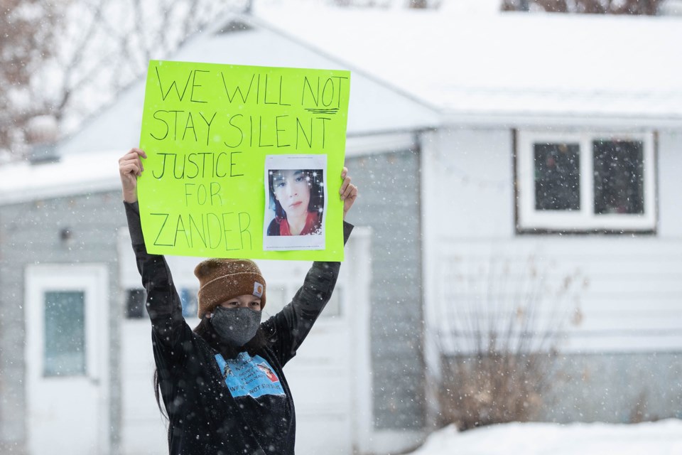 Family members of homicide victim Zander Jackson stood in front of the St. Paul Courthouse on Thursday, the scheduled date for the first appearance of the two men accused of second degree murder. Janice Huser photo