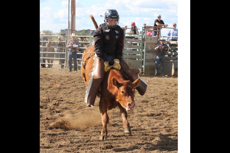 Kacen Nowicki riding to the buzzer at the 2022 Billy McDonald Rodeo Company Lac La Biche Open Rodeo.
