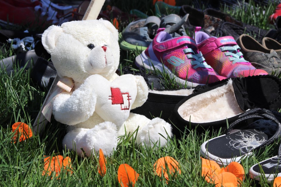 A memorial that included shoes and stuffed animals was set up. Photo by Robynne Henry.