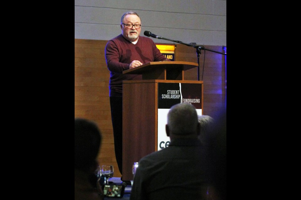 Ken Scullion at the podium on Friday night, during the Portage College scholarship fundraising night. 