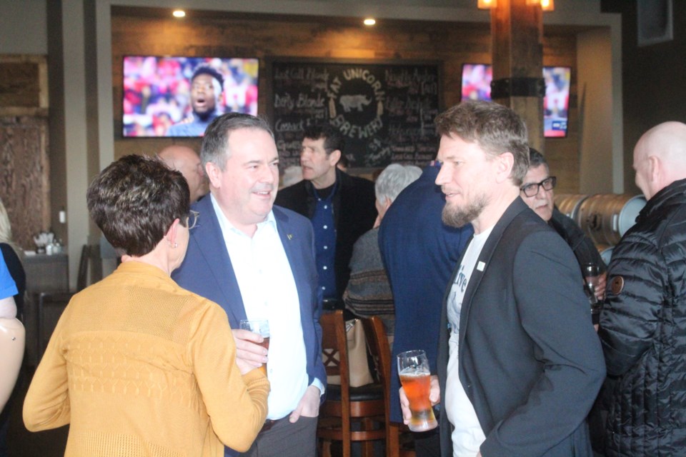 Alberta Premier Jason Kenney chats with Lac La Biche County councillor Colette Borgun (left) and Mayor Paul Reutov at Thursday's informal meet and greet at Lac La Biche's Fat Unicorn Tap House. The short-notice event drew a few dozen current and former area politicians, industry representatives, business officials, as well as school and college administrators.