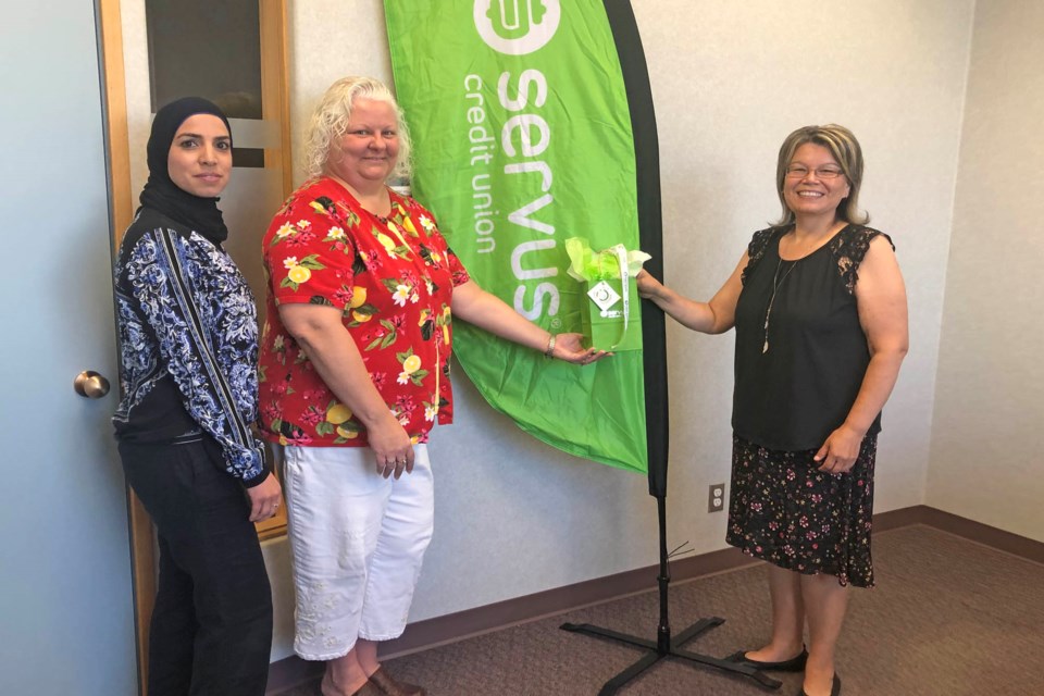 Kikino School principal Laurie Thompson is preented with $1,000 in local gift cards for her application to the Servus Feel Good Movement campaign.