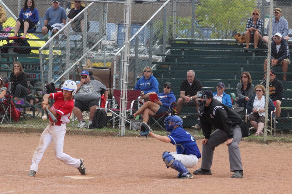  A batter connects with a pitch at the main baseball diamond during a game from a recent tournament hosted by the Lac La Biche Lumberjacks AA midget team.    Image: File /  Rob McKinley