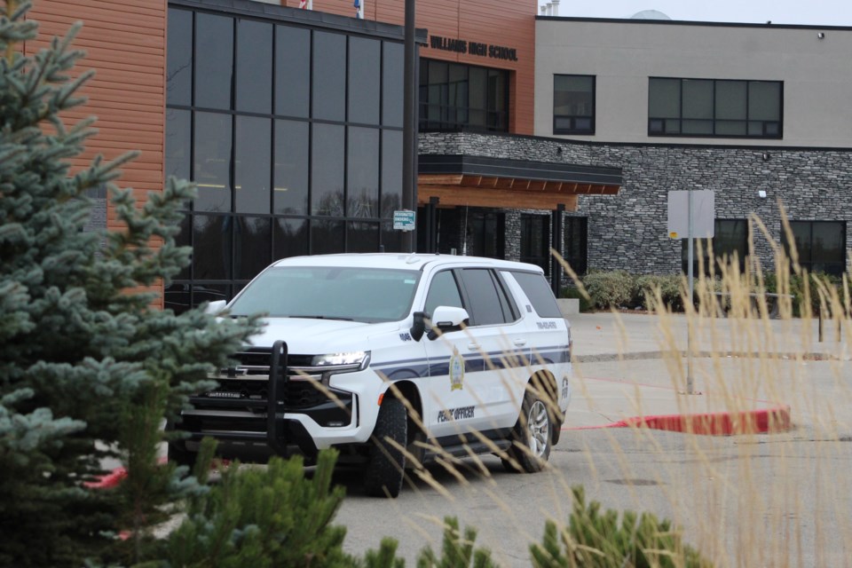 An unoccupied Lac La Biche County Community Peace Officer vehicle sits at the Bold Center entrance doors near the J. A. Williams High School on Tuesday morning. Police patrols in the area were increased over the last week as several internet-based threats against local schools were investigated.
