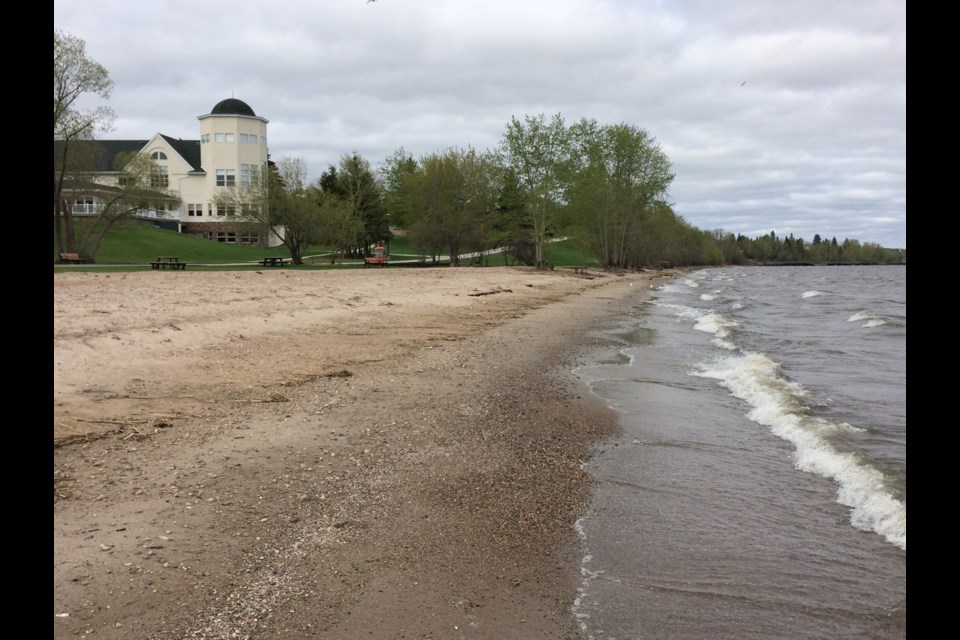 A little more beach.  The waves roll onto the beach at McArthur Park in Lac La Biche last Tuesday morning. The waters of Lac La Biche lake and others in the region seem lower this year. A new watershed management plan is being approved by municipal officials that will address many water-related issues