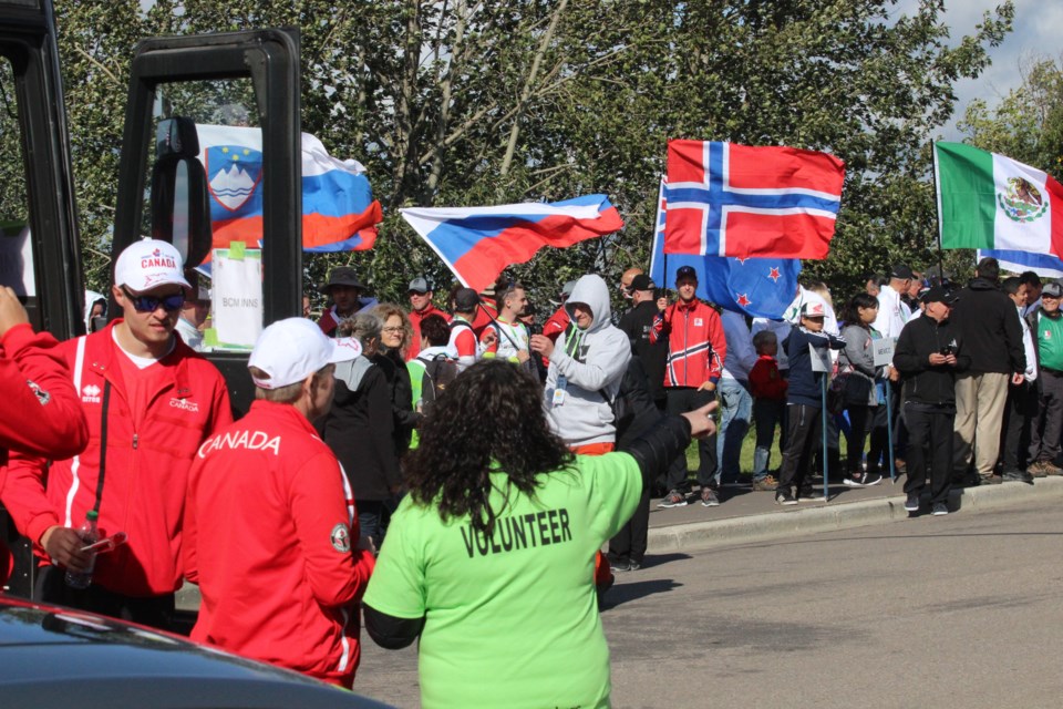 A volunteer helps to direct participants in the parade of nations that opened the 2019 World 3D Archery Championships in Lac La Biche. The community and the Lakeland Archers are again welcoming the world in 2024 for the World Archery Field Championships.   File photo Rob McKinley