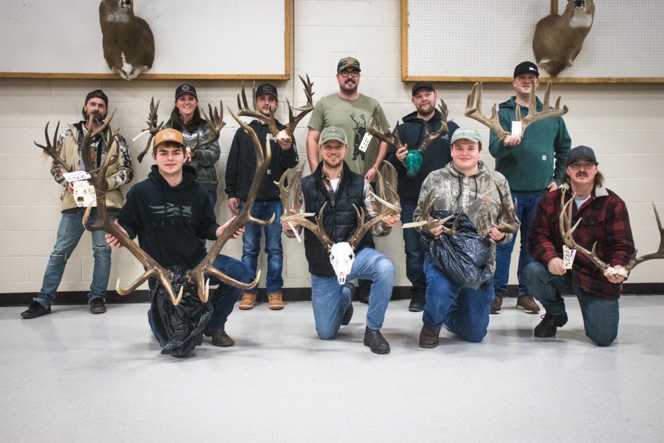 Winners of the fourth annual Trophy Measuring Day at the St. Paul take a group photo.