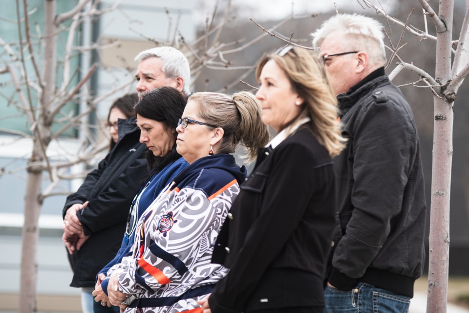 Tracy Ghostkeeper (focused) speaks about the death of her nephew as a result of workplace accident during the Day of Mourning Ceremony at the Town of Bonnyville in April 26.