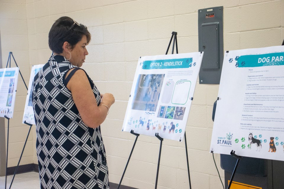 A resident examines the Town of St. Paul's information about the proposed off-leash dog park during an open house at the Recreation Centre on July 9. 