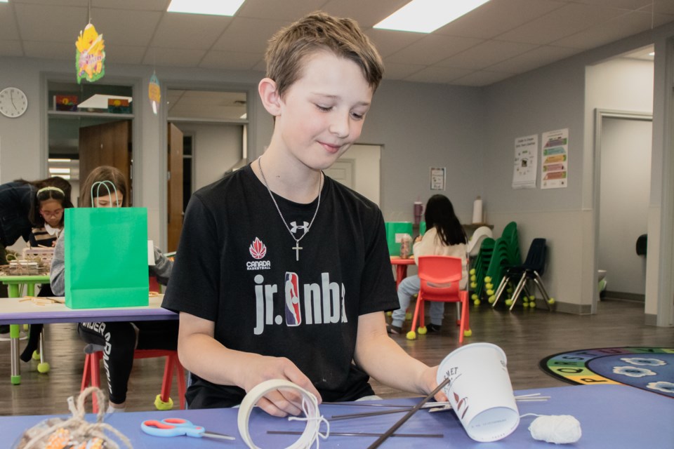 During the Youth Earth Day event hosted by the Lakeland Family Resource Network, Huxley Poulin participated in an activity where youth are challenged to present a solution to a given situation using recycled materials.