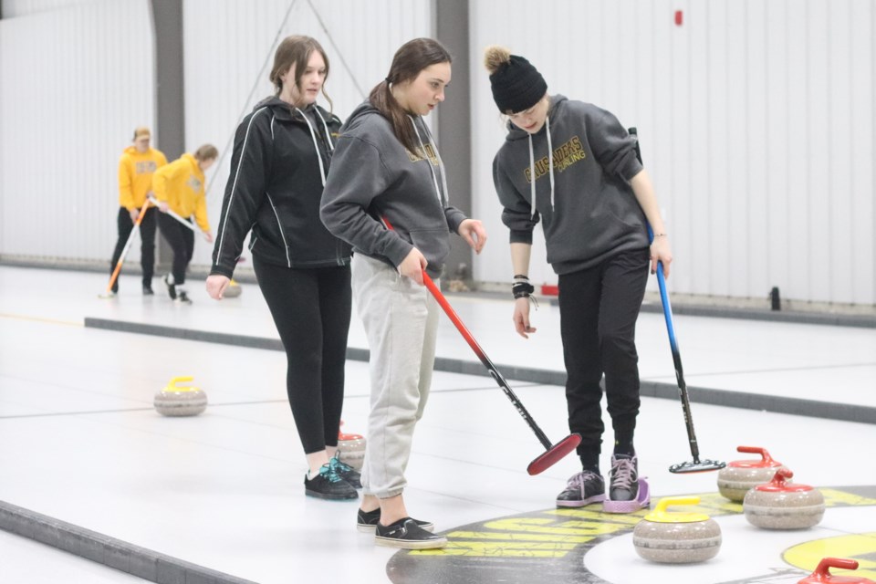 F.G. Miller's team plays against St. Paul Regional School for the 2023 Senior St. Paul Athletic Association’s curling girls' banner.