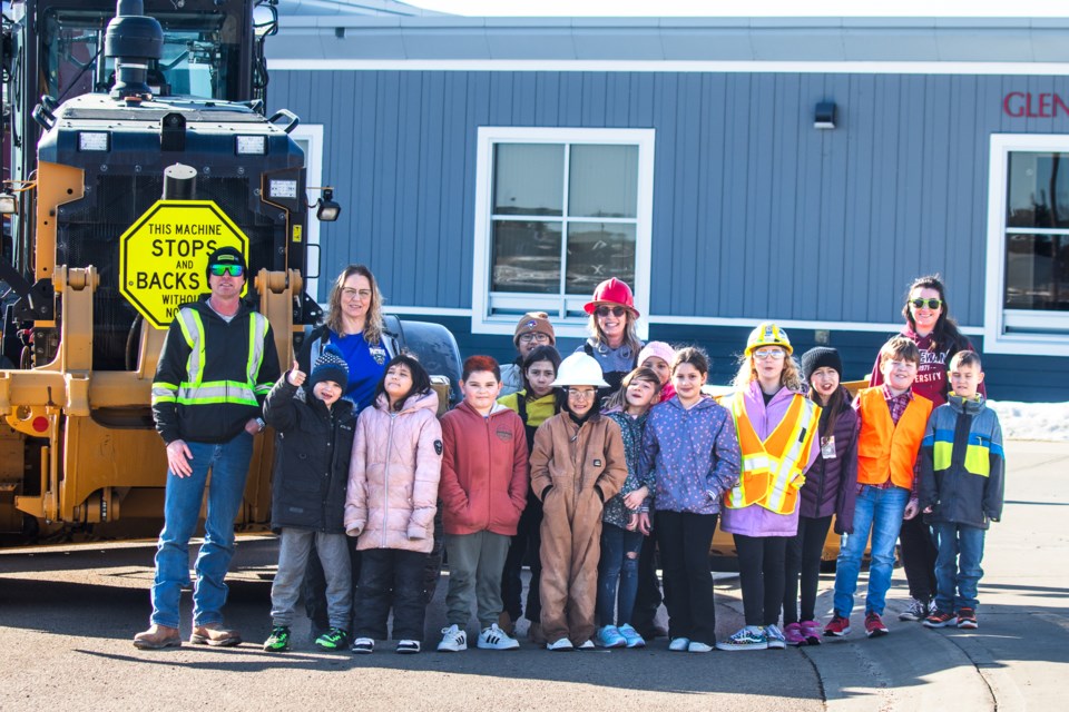 Behind the Grade 3 students from Glen Avon are County of St. Paul Public Works Assistant Director Randy Winterbottom, former assistant principal and substitute teacher Jackie McDonald, Teacher Juanita Labant, and County of St. Paul Communications Coordinator Emma SchreinerVonk.