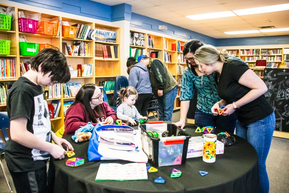 Residents of Glendon check out the books and activities available at Glendon's public library during its grand opening on Jan. 27.