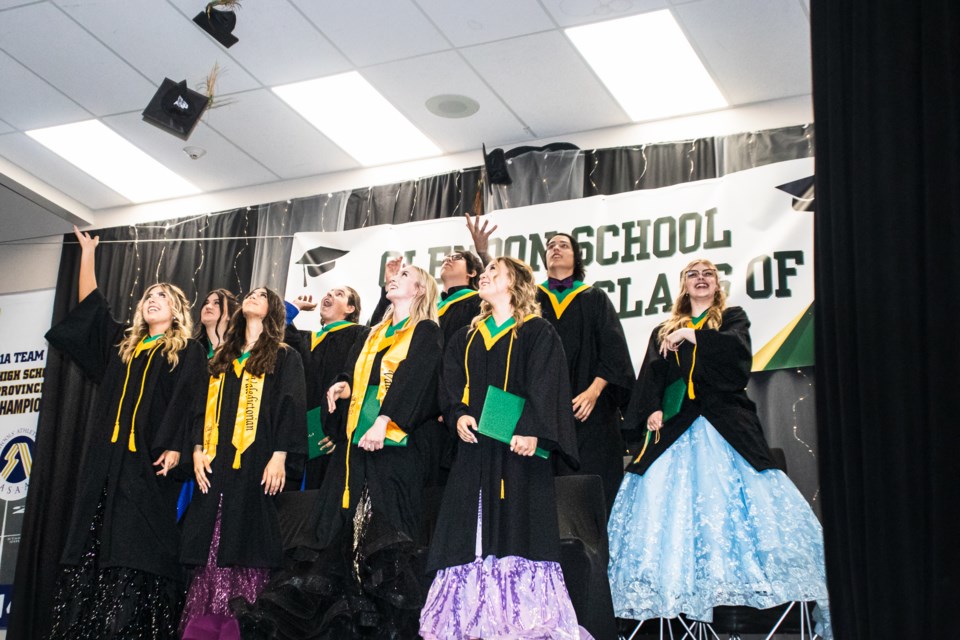 Class of 2024 tosses their caps. 