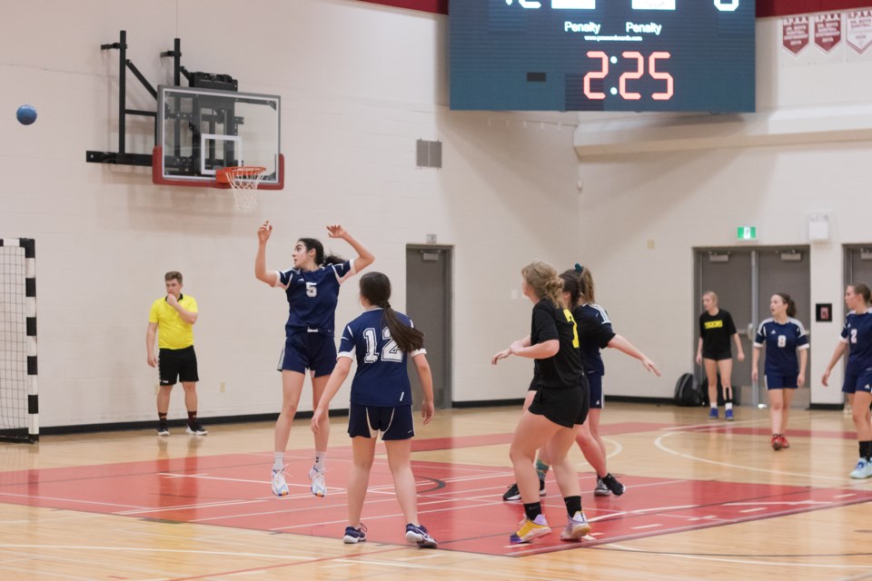 Mallaig (blue jersey) and Two Hills girls' teams compete for a spot at the finals during the the NEASAA Zone handball championship tournament on May 3 at Ashmont School.