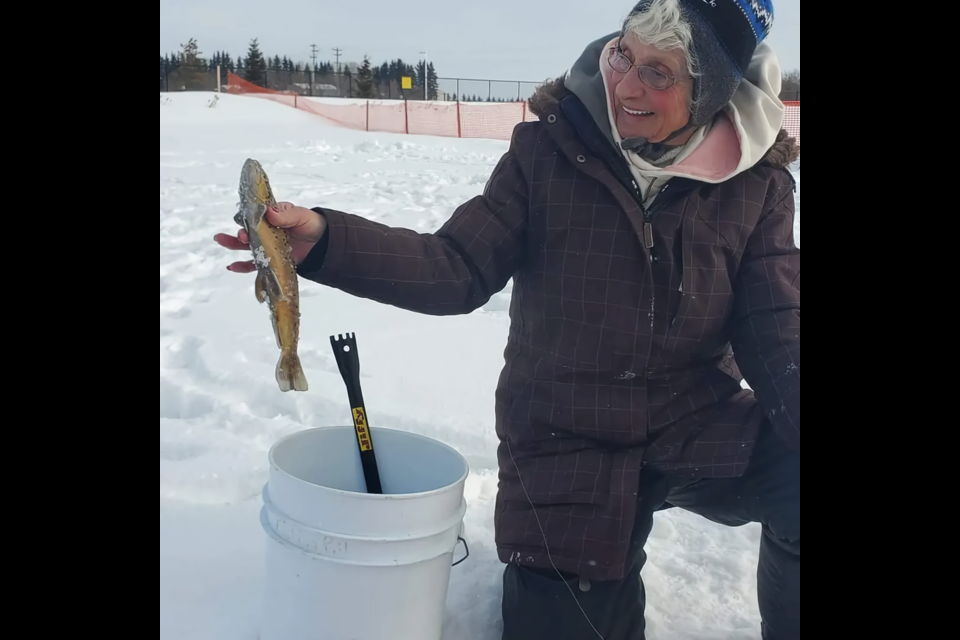 Juliette Tremblay, wife of Alphonse Tremblay, was present during the fishing derby, reeling in a 32-centimetre catch of her own.