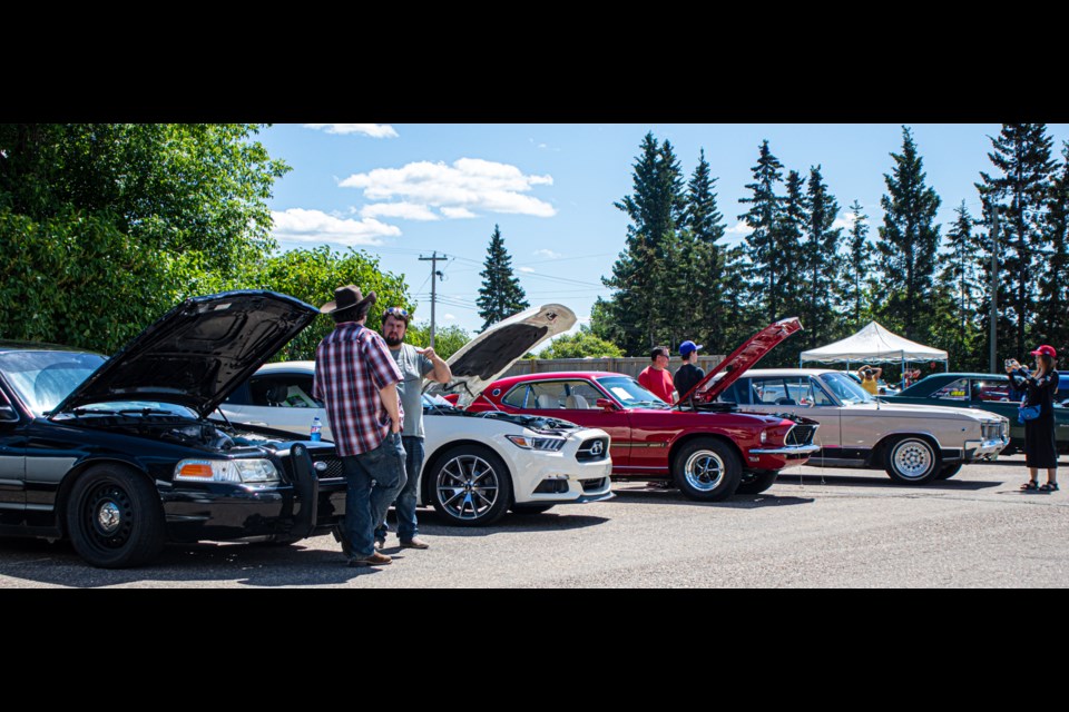 An array of vehicles, from vintage classics, to more modern looking trucks and cars, and vehicles built from scratch, line Ashmont's main street during its annual car show on June 17.