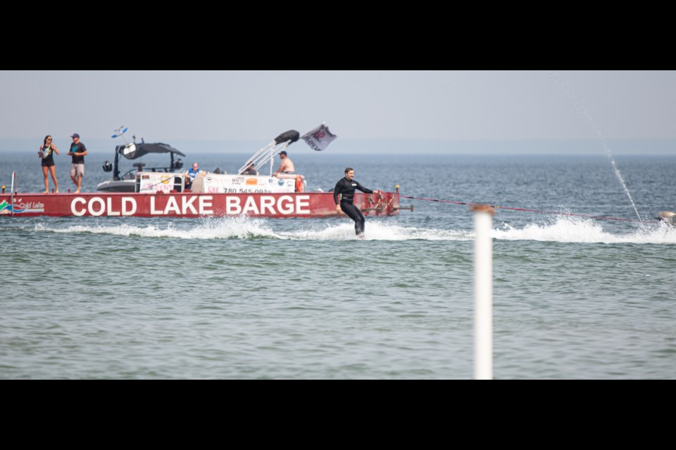 A wakeboarder skims across the surface of the Kinosoo during the 2023 Alberta Wake Tour in Cold Lake on July 8.