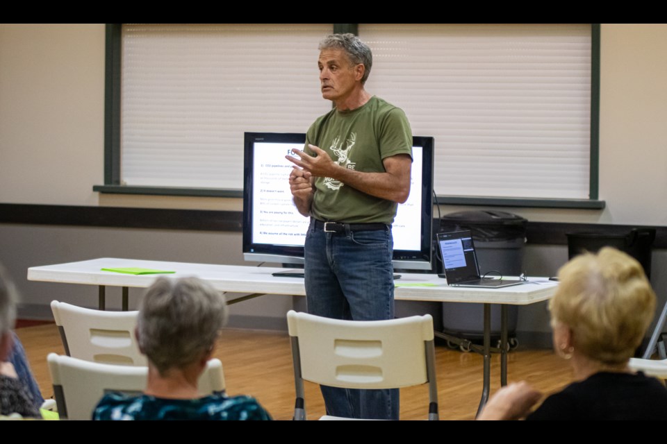 Amil Shapka talks about the risks of CO2 pipelines during a "No to CO2" information session on Aug. 1.