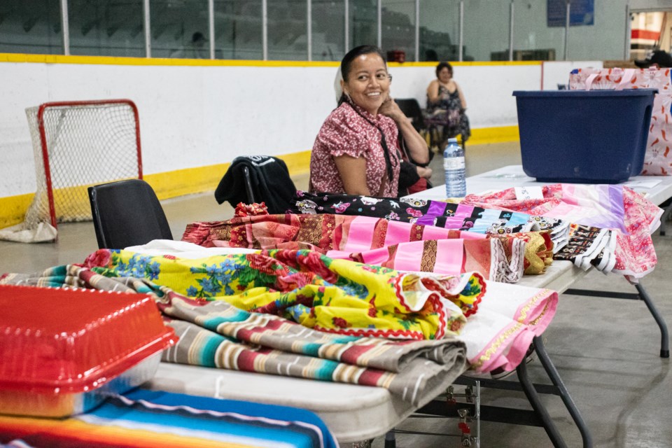 Beverly Pasquayak, a Saddle Lake-based seamstress, offers crafts, fried bannock, and ribbon skirts.