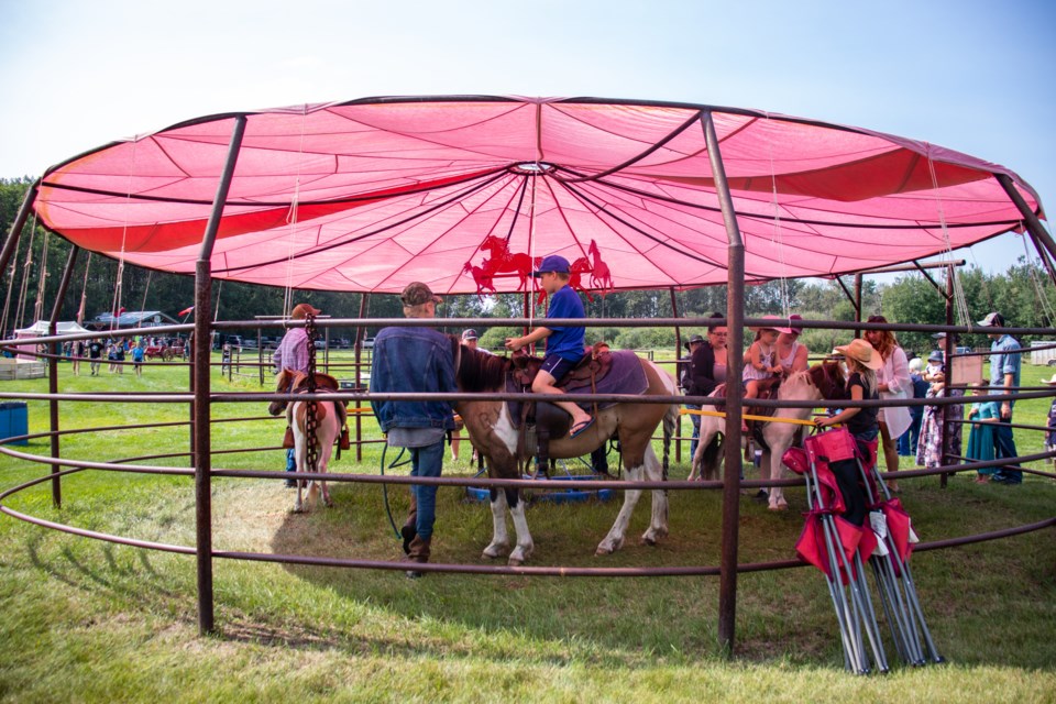 Children have fun riding horses and ponies all day long.