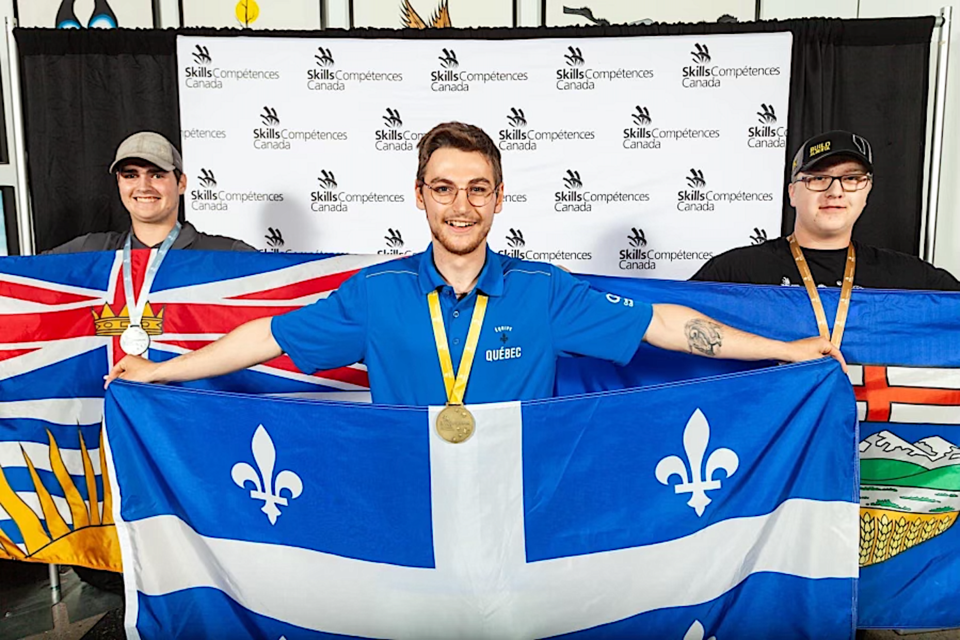 Logan Peters (right) takes home the bronze medal for Alberta at Skills Canada's Carpentry category at the secondary level.
