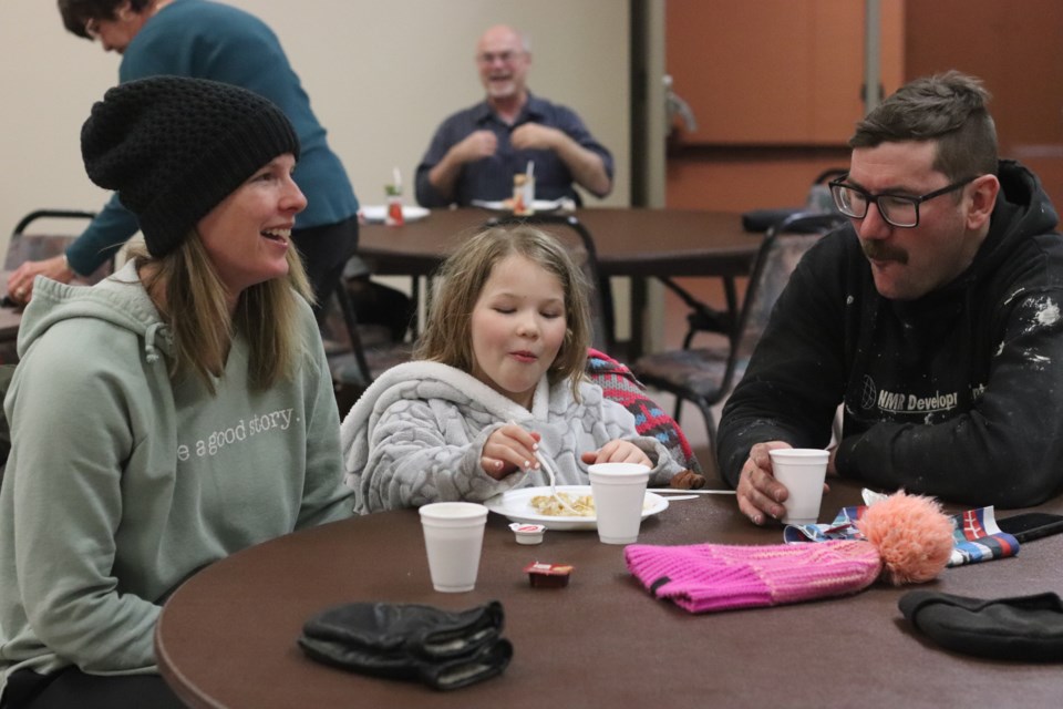 The Rosychuk family is pictured enjoying a pancake breakfast. 