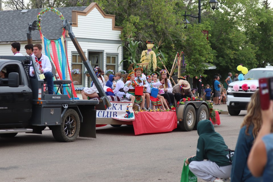 Crowds line the historic main street of the Village of Vilna during a parade on Aug. 20.