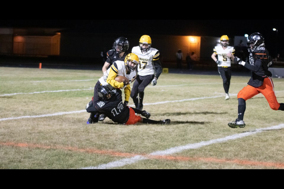 The St. Paul Lions make a successful tackle.