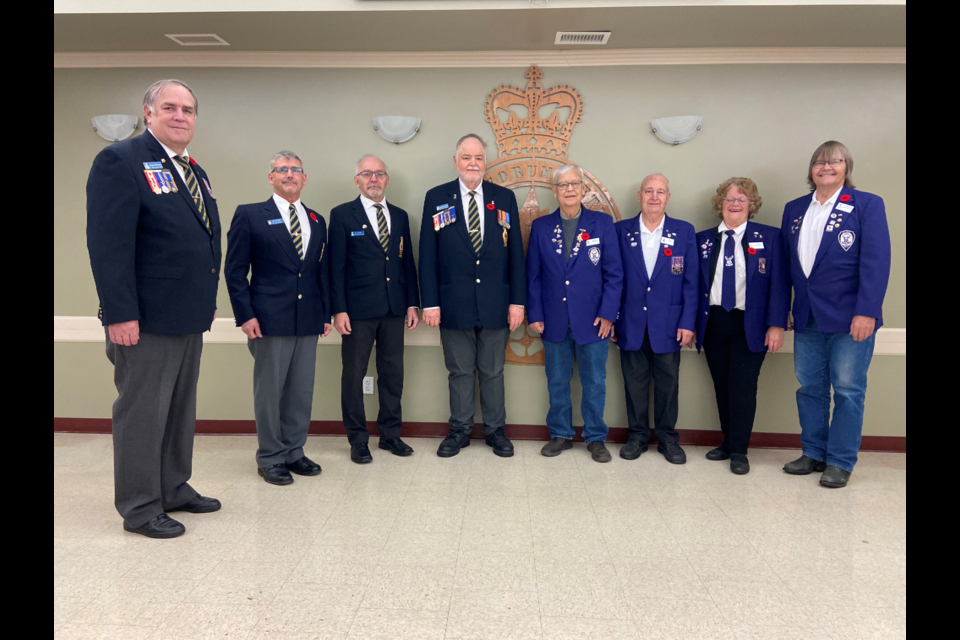 Legion members from left to right, Duane Fleming, Russ Whitfield, Bill Blower, and Ken Brodziak, along with Elk Members, Lawrence Ostapovitch, Linda Kryzanowsky, Jim Turton, and Ernie Formanek.