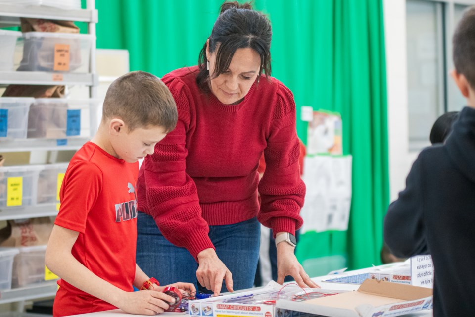 Terra-Lee Gratton assists a student with a STEAM-based activity on Nov. 8.