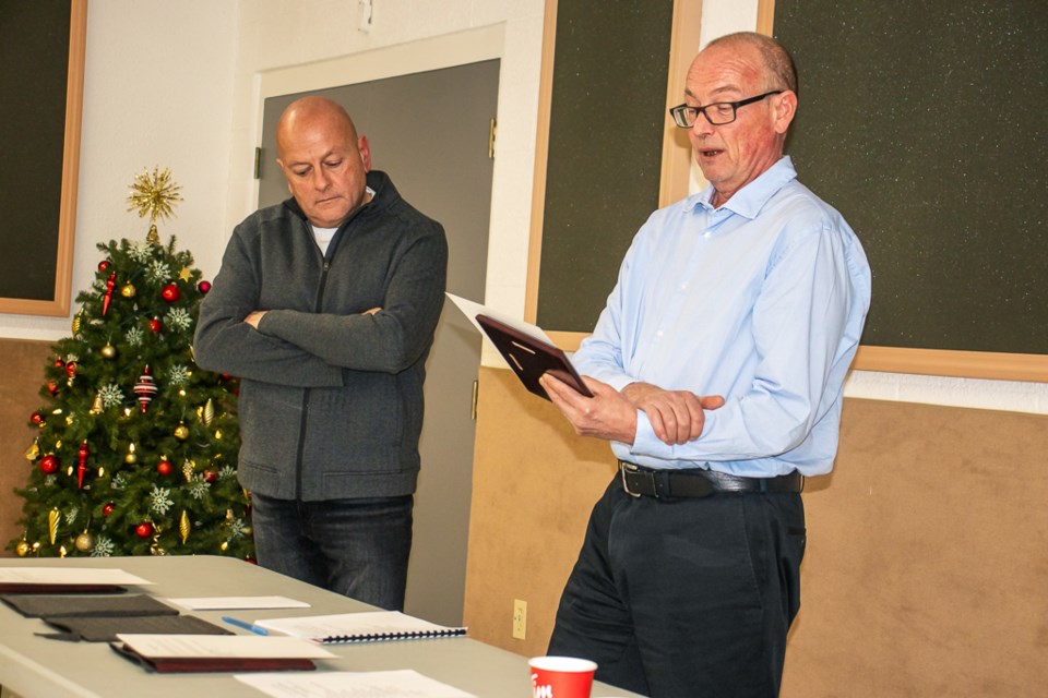 Leonard Gagne (left), outgoing president of SPAN’s board and SPAN Executive Director Anthony opden Dries (right) speaks during SPAN's annual general meeting on Nov. 16.