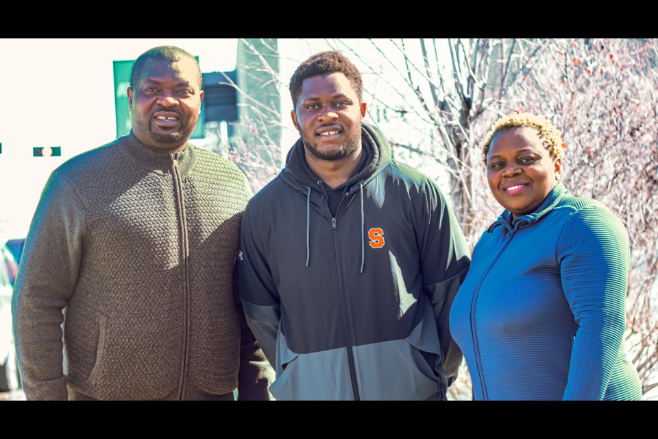 From left to right are Alfred, Helmon, and Sylvia of the Ndose Family.