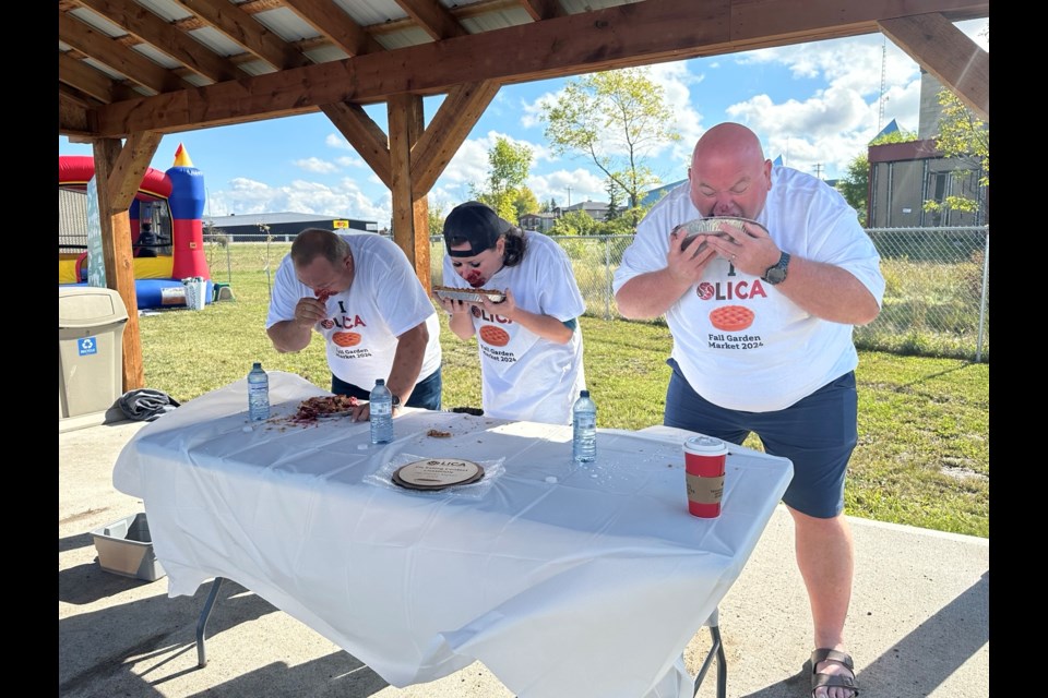 Summer Village of Bonnyville Beach CAO Corey Dows (left), LICA Community Outreach Coordinator Tanya Orr (middle), and Cold Lake Deputy Mayor Chris Vining compete during the pie eating contest.