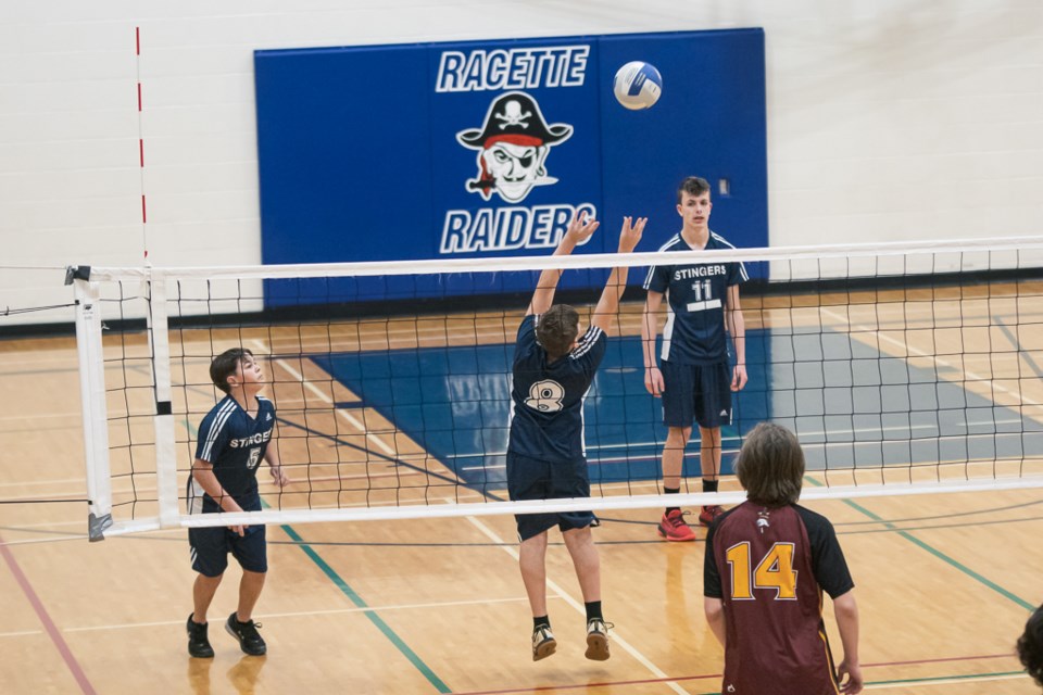 Mallaig Stingers (blue) clash against F.G. Miller Crusaders during the semi-finals of the boys’ St. Paul Athletic Association (SPAA) junior high volleyball championships.