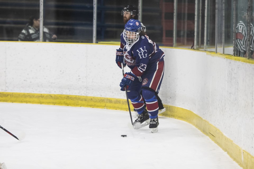 Jacob Leroux retrieves the puck during the Feb. 15 game against the Onion Lake Border Chiefs.