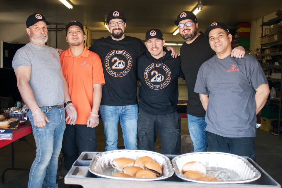 From left to right are staff memebers Gene Graves, Renjay Dizon, owner Rick Levasseur, Hank Olson, Rob Levasseur, and Rey Ordona, who put on the chef hats for the day to cook barbecue for the community.
