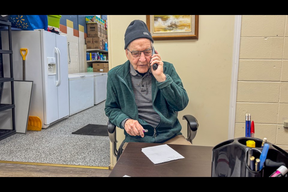 Larry Lambert speaks to a client over the phone.