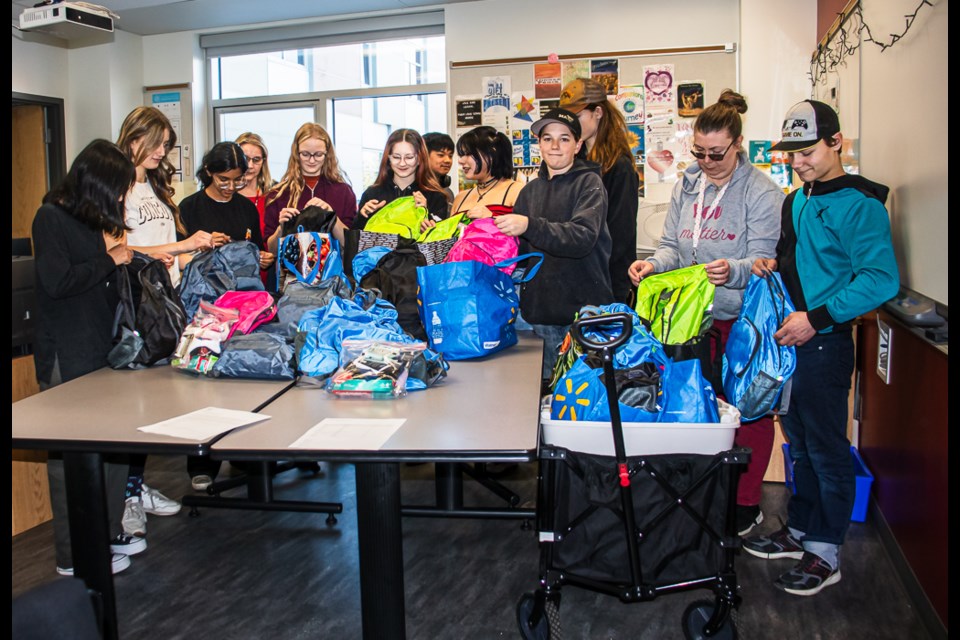 Racette Jr. High School's Leadership Class helps pack bags with toiletry.