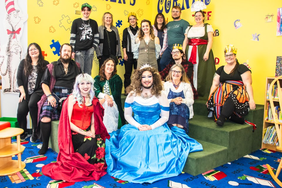 Event volunteers and some of the attendees pose for a photo with Lush PanHick at the St. Paul Municipal Library on Feb. 1.