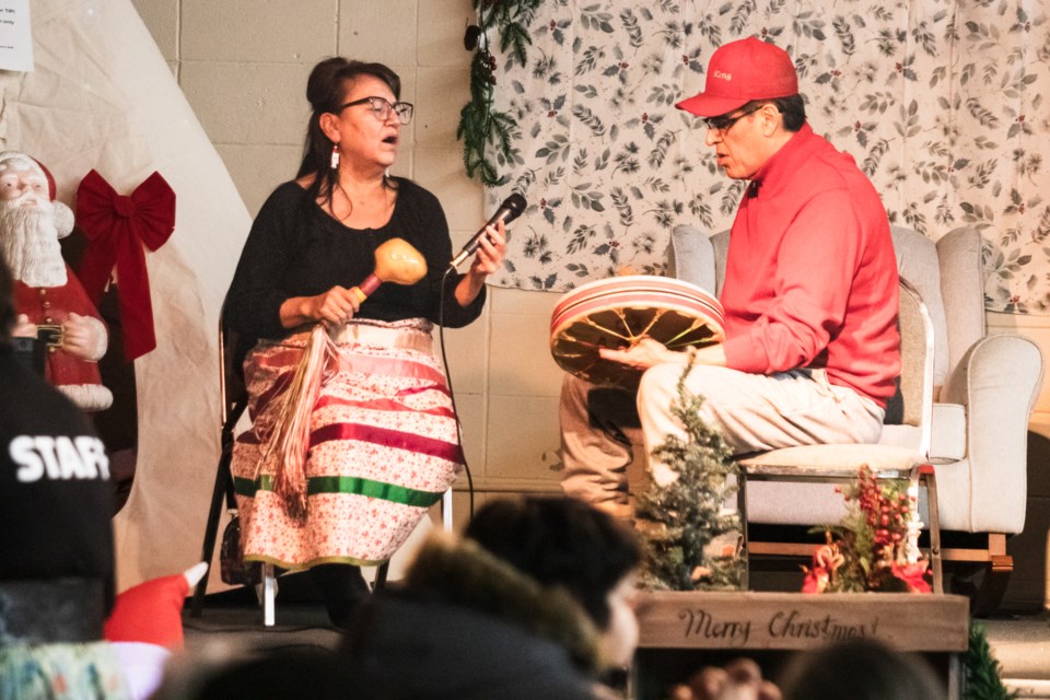 Priscilla and Leo McGilvery, singers from Saddle Lake Cree Nation, serenades attendees.