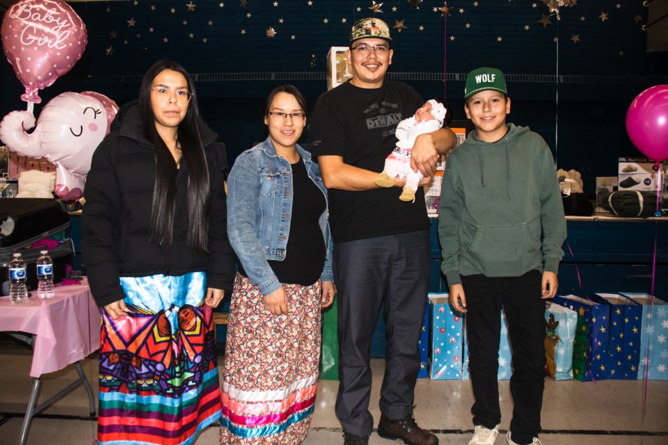 Sariyah Cardinal, held by her father Carl Cardinal, is Saddle Lake's first New Year's baby. From left to right is Sariyah's family, her sister Kylence Cardinal, her mother Eve Mckay, her father Carl Cardinal, and her brother Kendrick Cardinal.