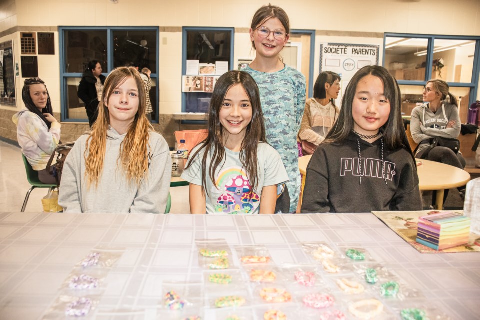 From left to right are Mirabelle, Caerys, Lilly, and Seoyeon, who worked together to make and sell bracelets along with other accessories.