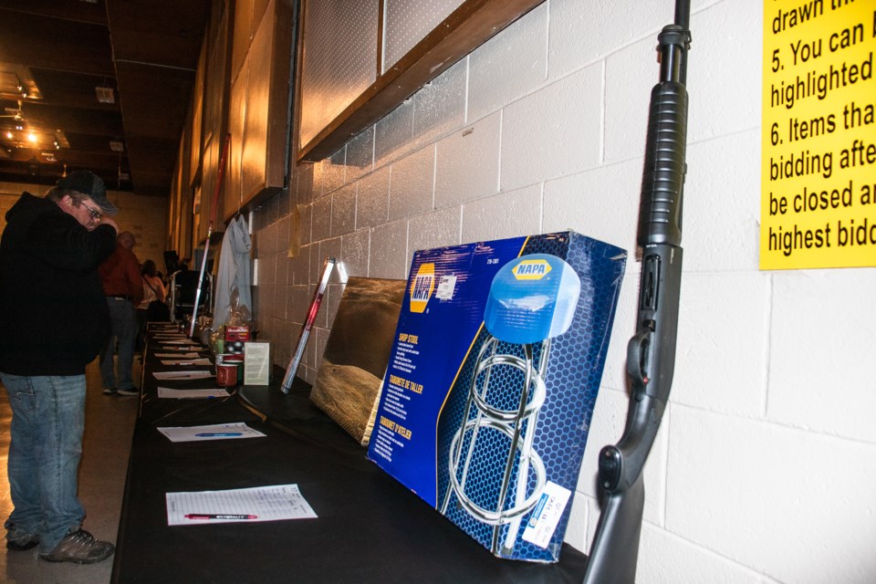 Attendees check out the auctioned items during the St. Paul Fish and Game Association’s (SPFGA) 30th annual supper and auction on April 27.