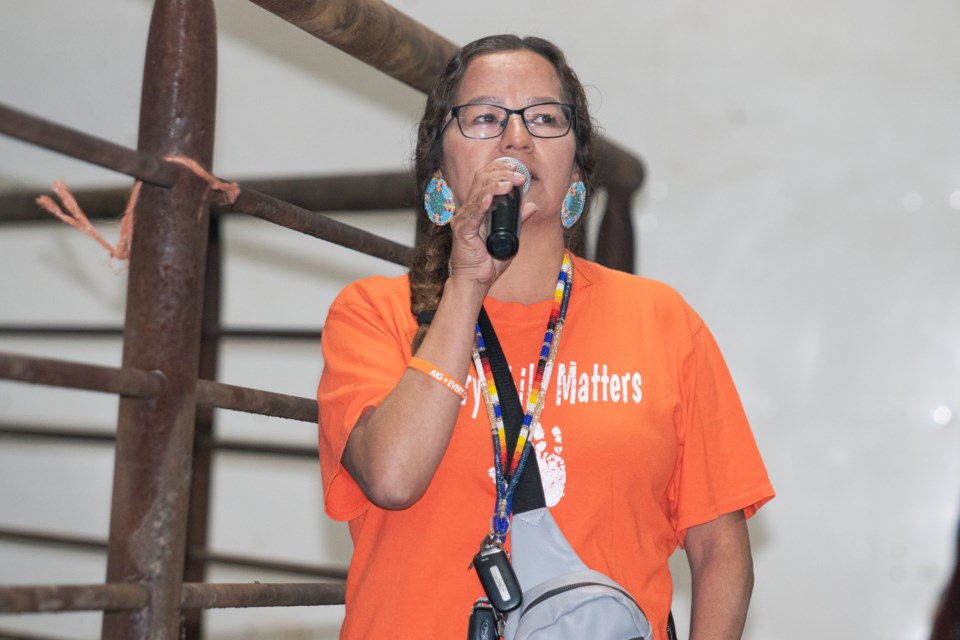 Stephanie Jackson, a part of the organizing committee, and also a councillor at Whitefish Lake First Nation, explains the inspiration behind the Bullarama during the event's opening ceremony on Sept. 28.