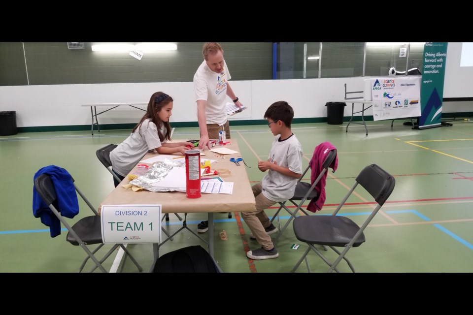 Participants work on creating a LED sign during the Science Olympics held at the Reid Field House. 