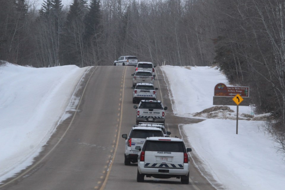 Peace officer vehicles from communities across Alberta roll down a Lac La Biche roadway during a day of driver training exercises offered recently at the local Law Enforcement Training Program.