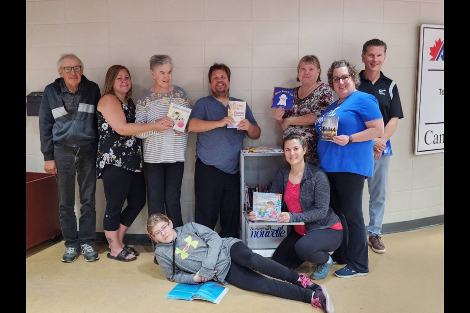 Back row left to right: Mike Koziol, Robyn Stanley, Jeanne Winstone, Josh Katish, Rosemary, Cinnamon, Glenda MacNeil, and Kevin Roth.
Front row: Emma King and Sage Karras.