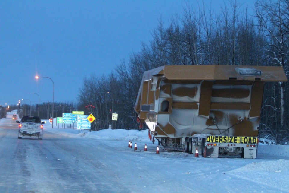 The box of a heavy hauler vehicle used in open pit mining sits on a trailer along Highway 36 near Lac La Biche last Tuesday afternoon. A collision between two Heavy Haulers on Thursday morning has claimed the life of one Fort McMurray man.